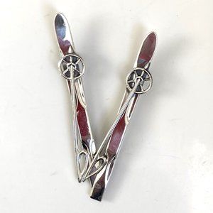 Delightful twin ski brooches signed Beau Sterling